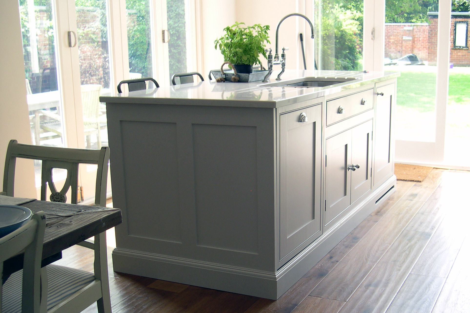 Bespoke kitchen Island with framed end panels and undermount sink